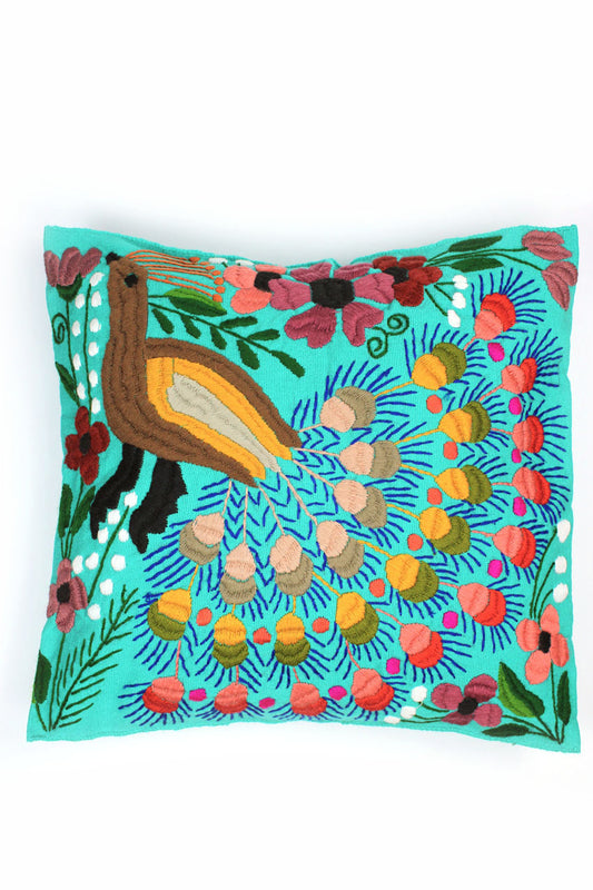 Cojín turquesa con diseño de pavo real