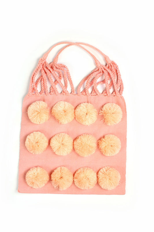 Bolsa de tela rosa con pompón