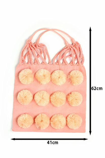 Bolsa de tela rosa con pompón